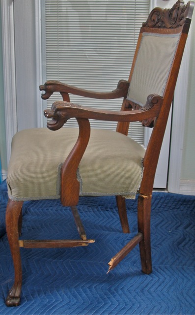 antique chair with broken leg