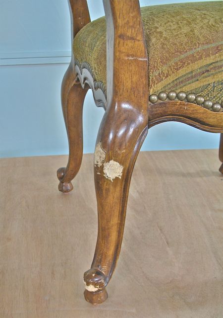closer view of chair chewed by dog